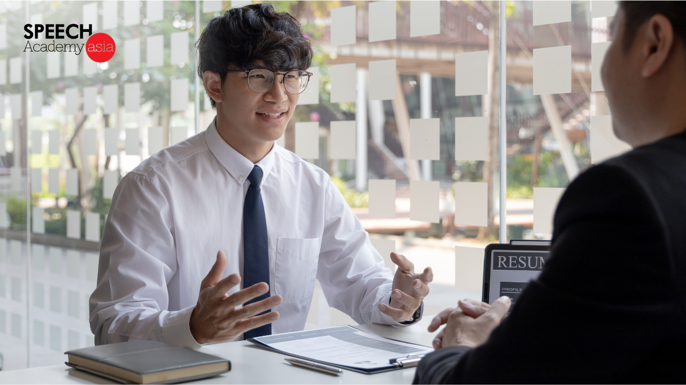 University student confidently answering questions during a mock interview at interview workshops in Singapore
