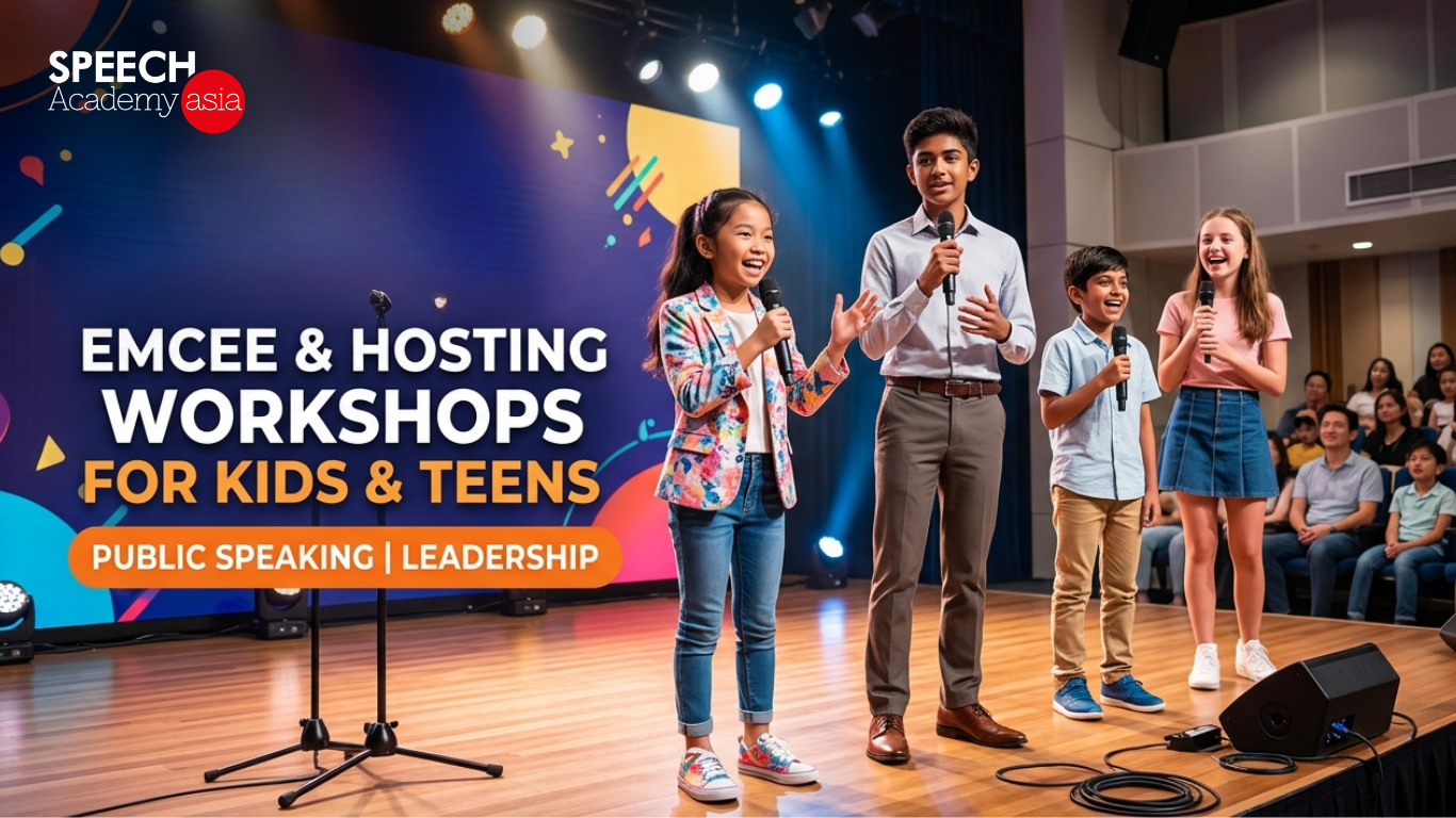 Diverse group of confident kids and teens practicing hosting and emceeing on a stage with microphones at Speech Academy Asia Singapore.