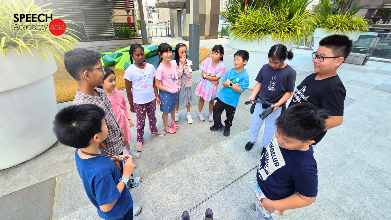 Speech Academy Asia students participating in outdoor holiday camp activities and confidence-building games in Singapore