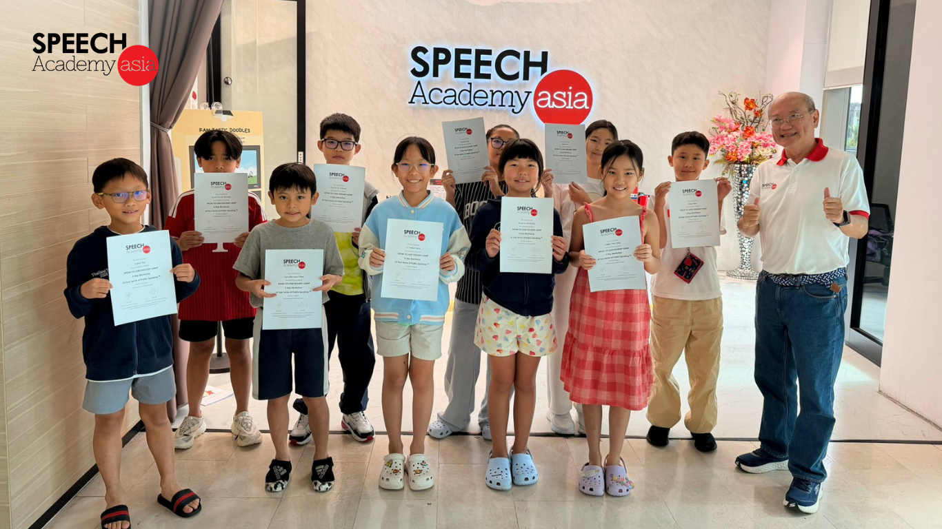 Speech Academy Asia students holding certificates after completing a public speaking course in Singapore