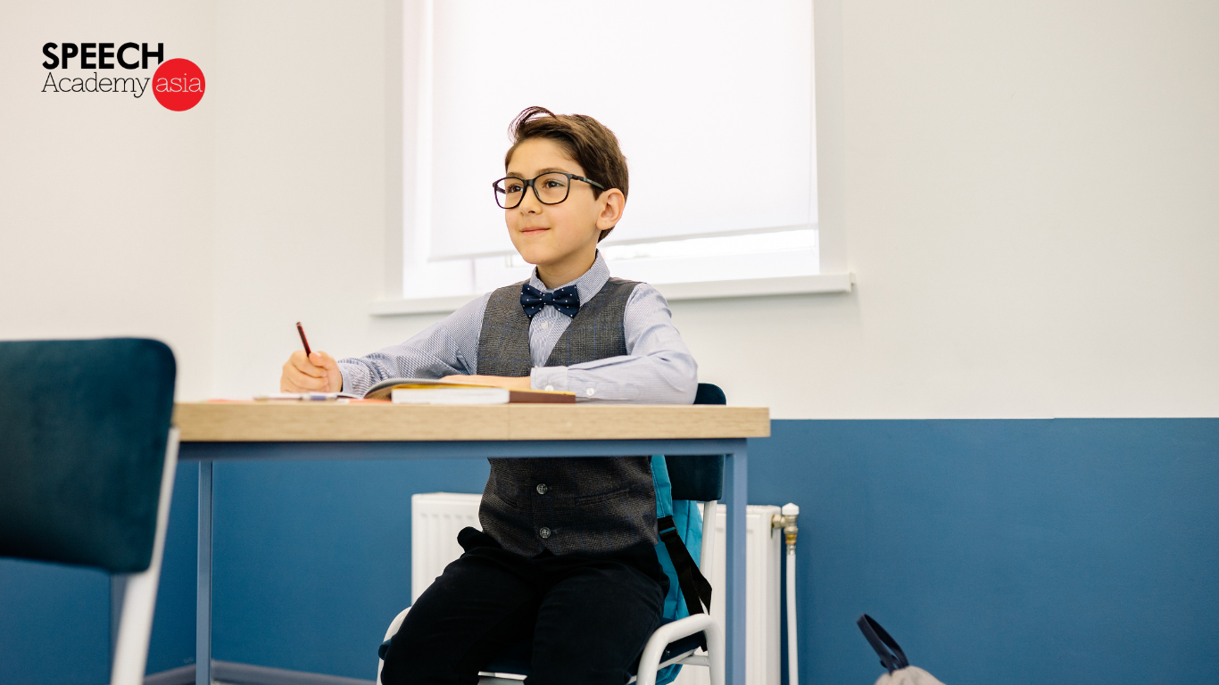 Communication classes in singapore. Boy listening attentively in class