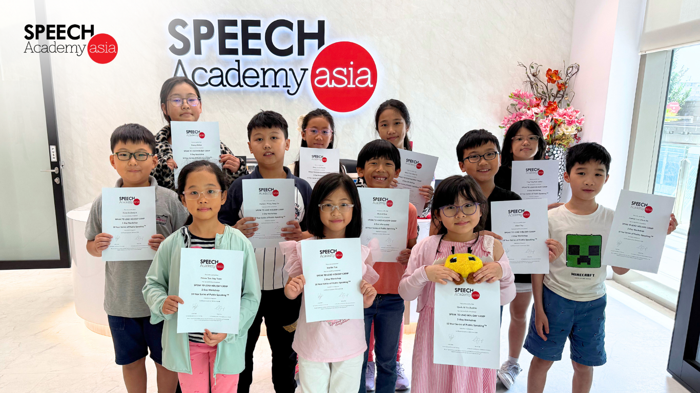Speech Academy Asia students holding certificates after completing a holiday camp